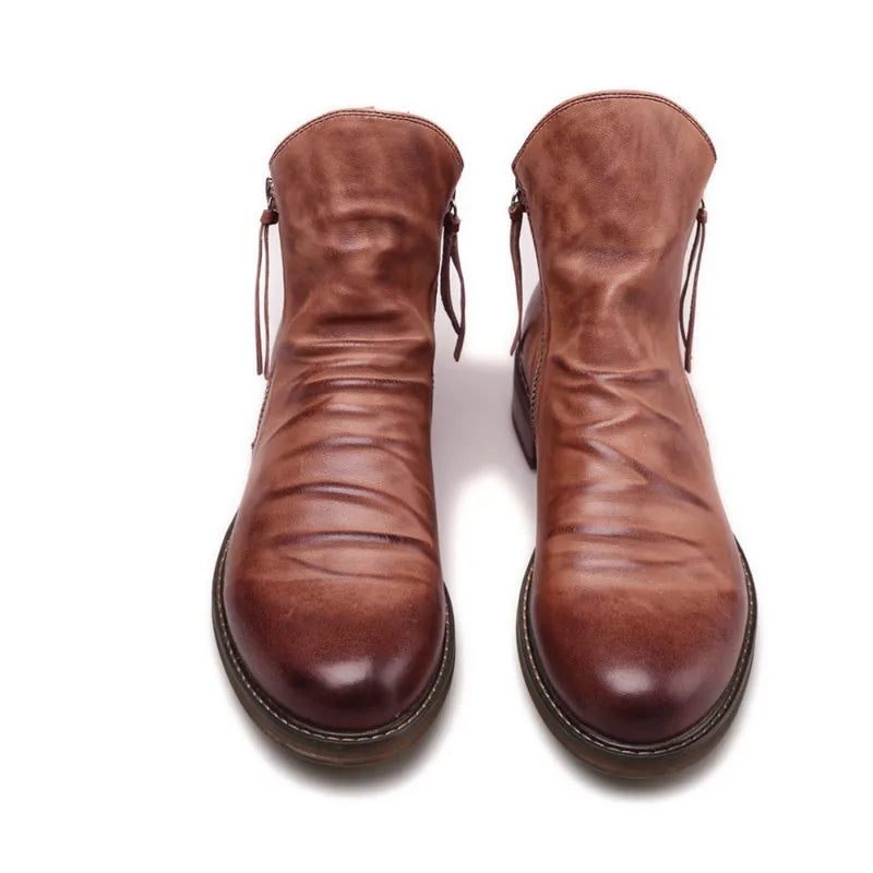 Keaton men's faux leather boots with a sleek Chelsea cut and a sturdy sole.
