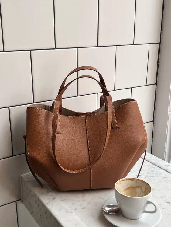 Clarise women’s elegant faux leather handbag with structured silhouette and versatile design