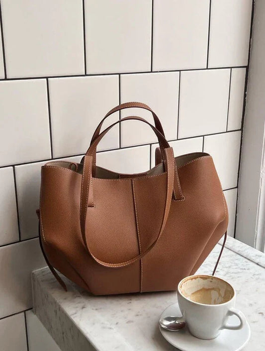 Clarise women’s elegant faux leather handbag with structured silhouette and versatile design