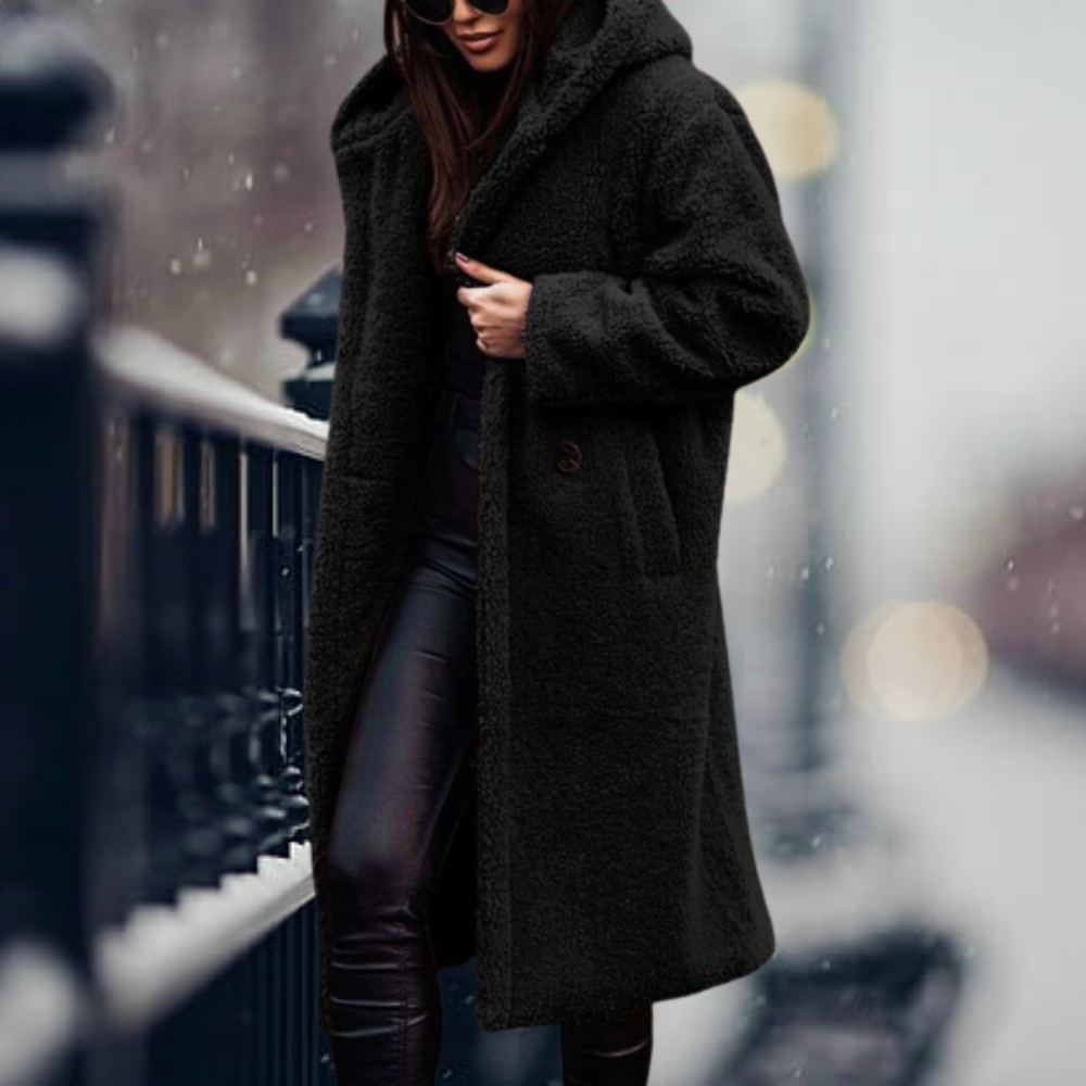 Fiorella women’s long polar style coat with tailored silhouette and flowing design for winter elegance