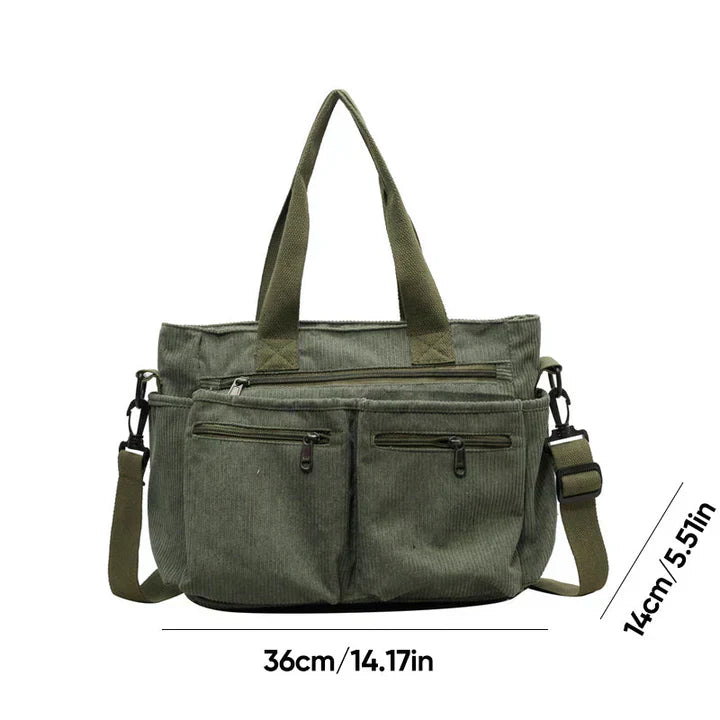 Celina women's handbag with a sleek, structured shape and two main zippered compartments.