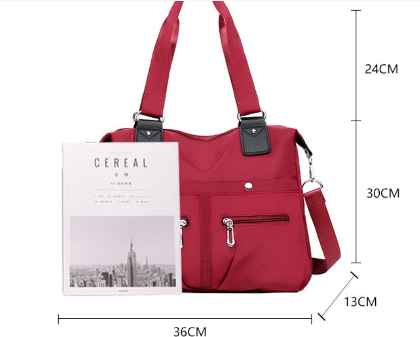 Amelie lightweight handbag with a structured shape and a clean, modern design.