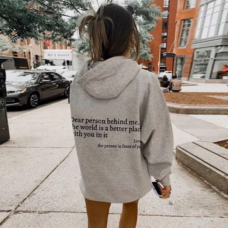 Joy unisex hoodie with an inspiring quote printed on the back.