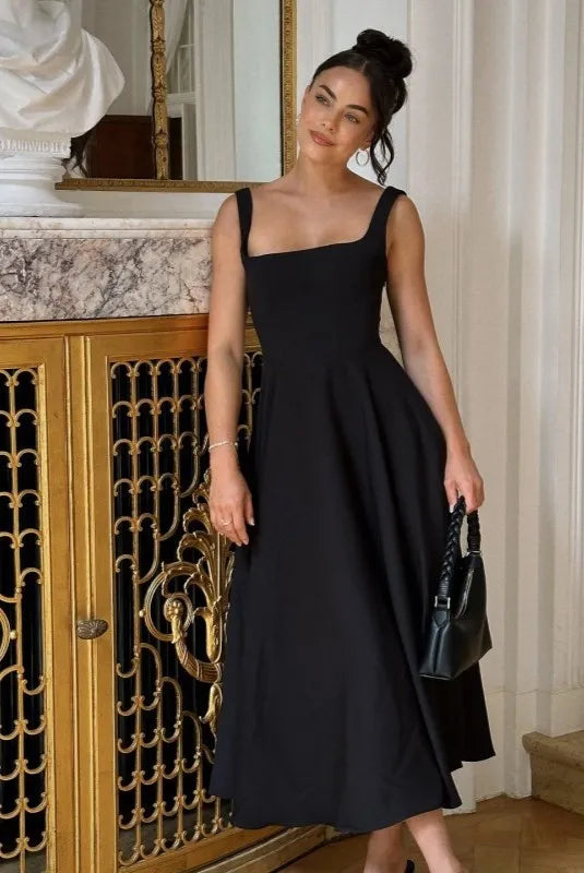 Clara women's midi dress with a high waist, square neckline, and a flowing skirt, in a solid color.