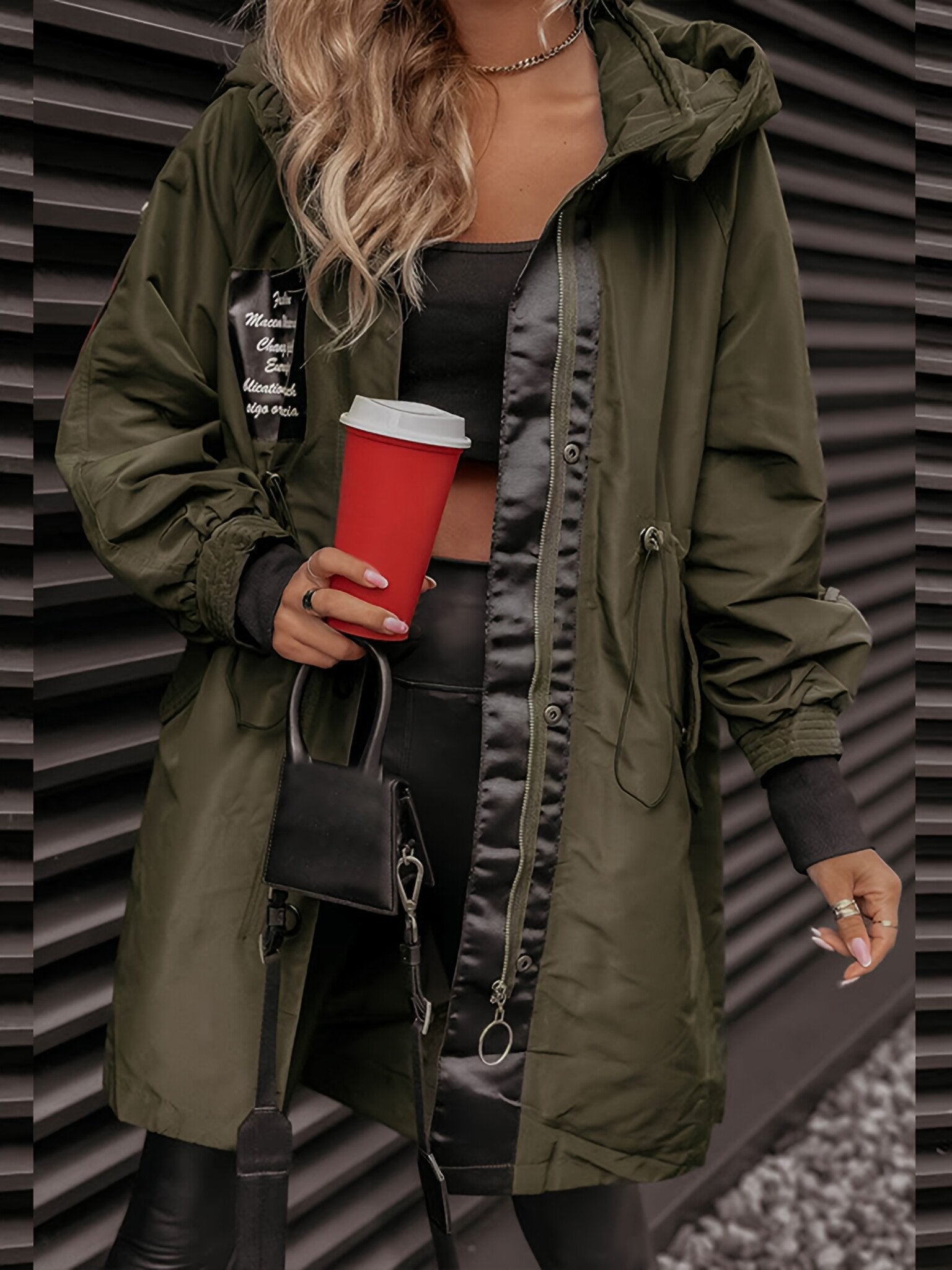 Naomi long sleeve hooded jacket for women, featuring a front zipper and an adjustable hood for warmth and style.