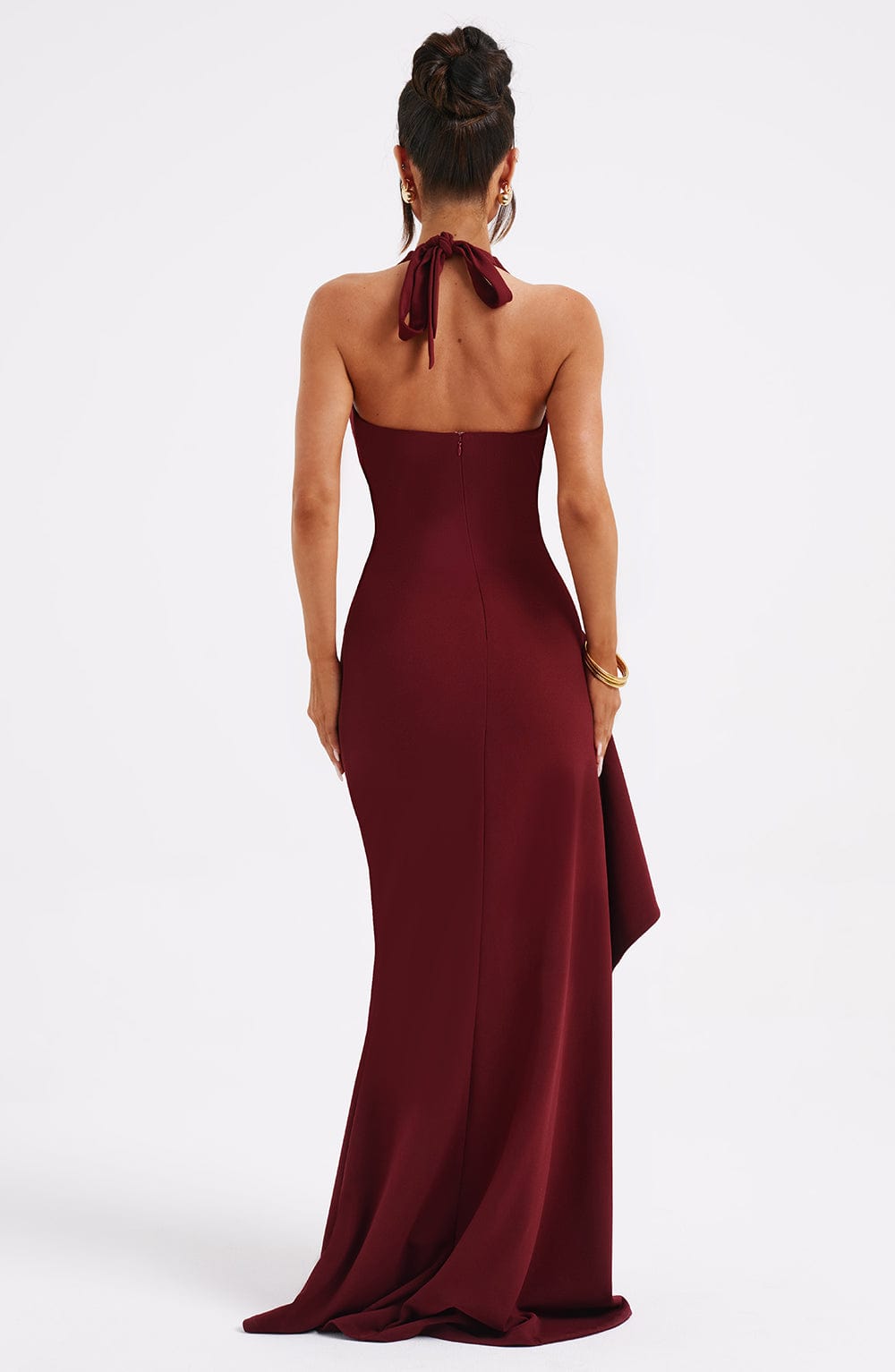 Maya elegant halter neck maxi dress with a flowing skirt and a subtle slit, in a solid color.