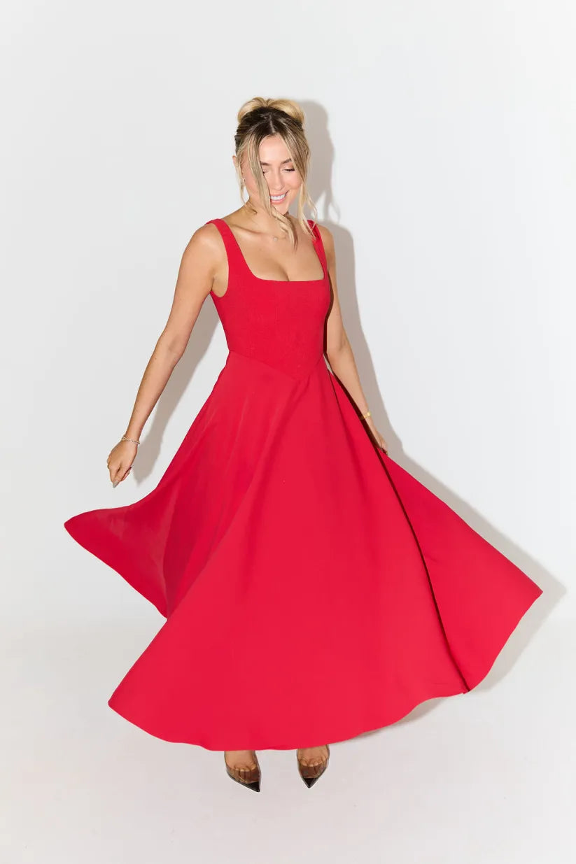 Clara women's midi dress with a high waist, square neckline, and a flowing skirt, in a solid color.