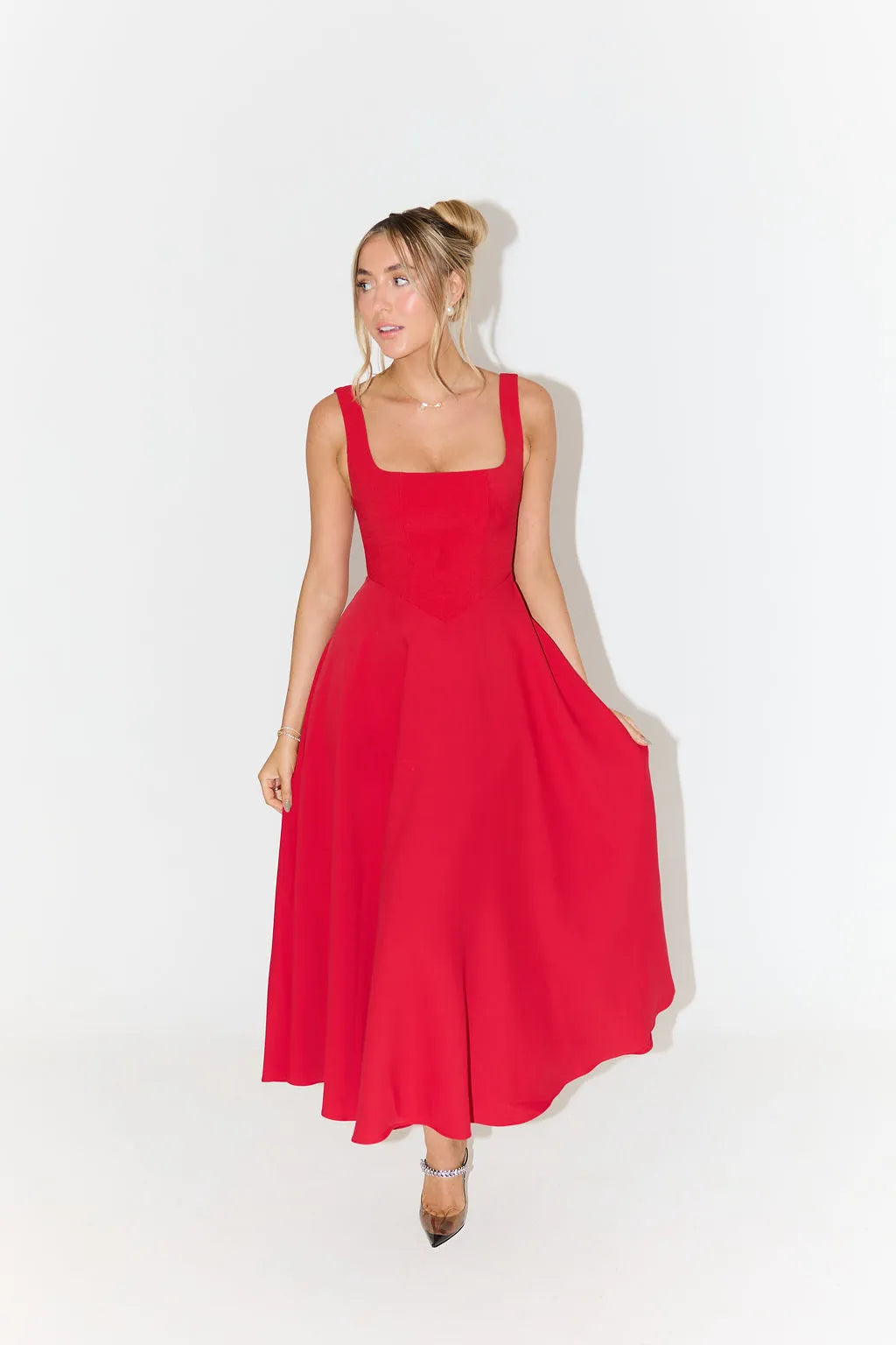 Clara women's midi dress with a high waist, square neckline, and a flowing skirt, in a solid color.