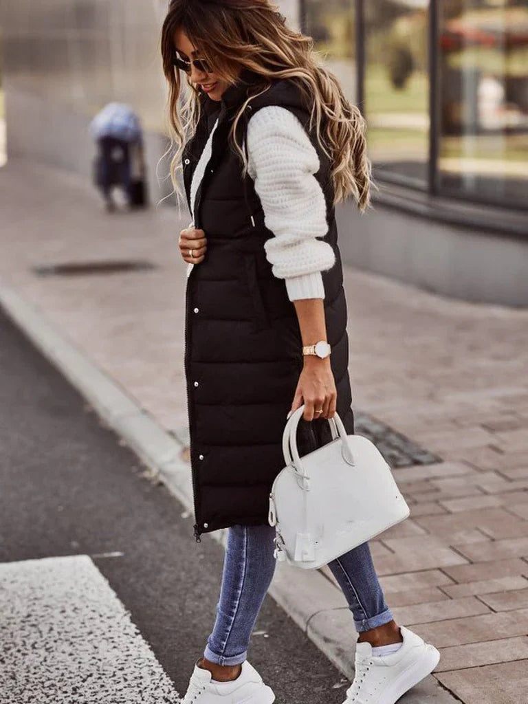 Women’s long quilted gilet with hood – black winter layering vest.