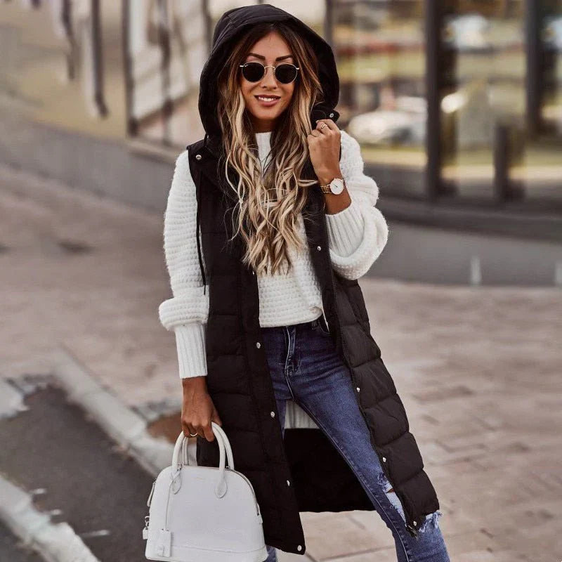 Women’s long quilted gilet with hood – black winter layering vest.