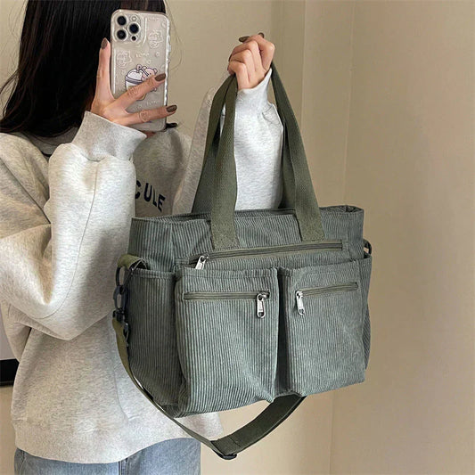 Celina women's handbag with a sleek, structured shape and two main zippered compartments.