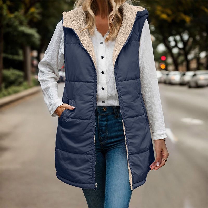 Anya reversible sleeveless jacket featuring one side with textured fleece and the other with a smooth, sleek finish.