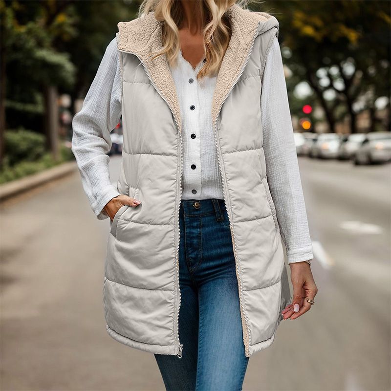 Anya reversible sleeveless jacket featuring one side with textured fleece and the other with a smooth, sleek finish.