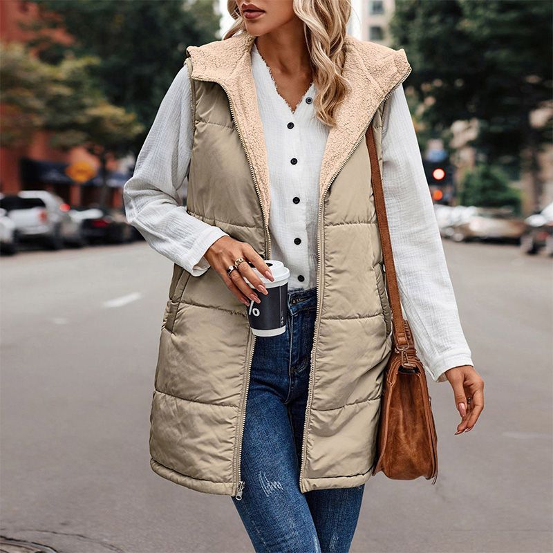 Anya reversible sleeveless jacket featuring one side with textured fleece and the other with a smooth, sleek finish.