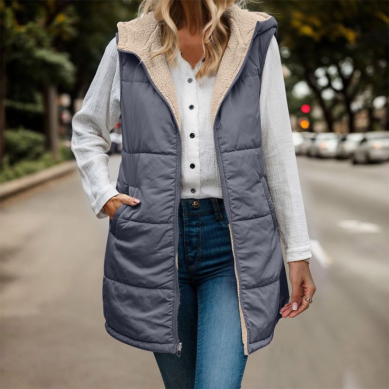Anya reversible sleeveless jacket featuring one side with textured fleece and the other with a smooth, sleek finish.