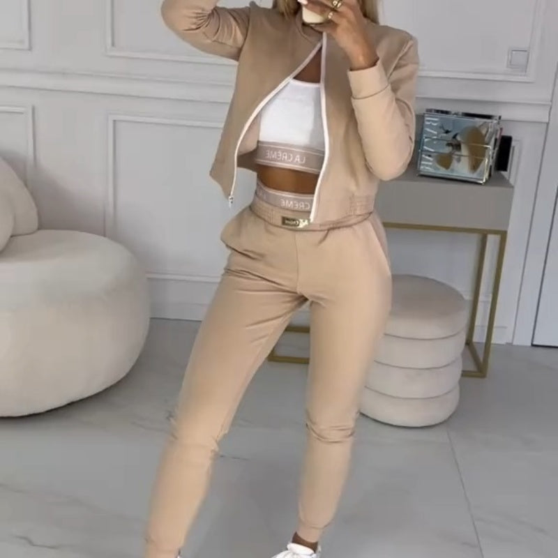 Sienna 3-piece tracksuit for women, with a zip-up hooded jacket, matching top, and comfortable pants.